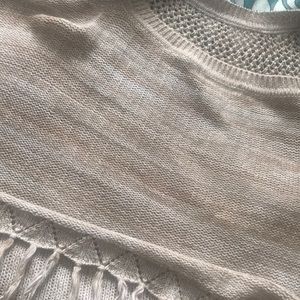 Brown and white fringed shall like sweater